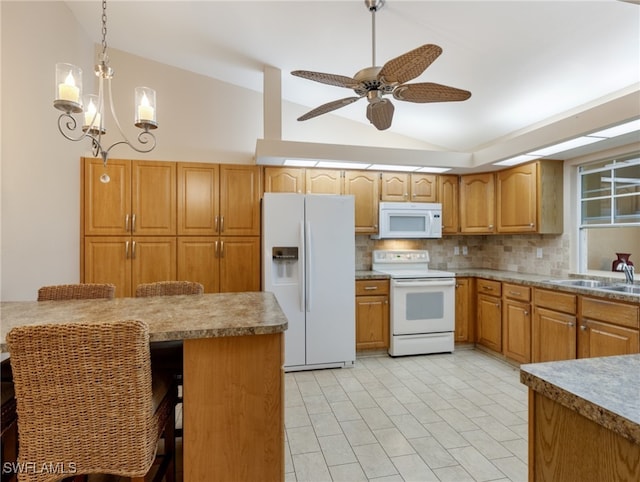 kitchen featuring lofted ceiling, hanging light fixtures, white appliances, a kitchen breakfast bar, and decorative backsplash