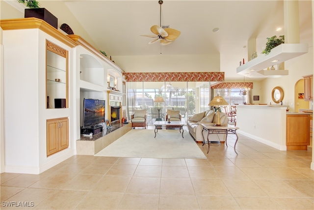 living room featuring high vaulted ceiling, ceiling fan, light tile patterned floors, and built in features