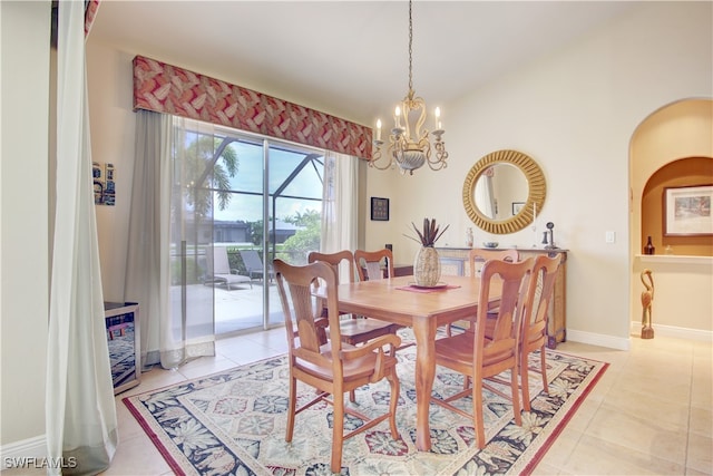 dining room featuring an inviting chandelier and light tile patterned floors