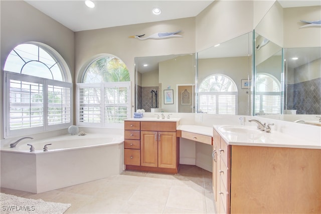 bathroom with plenty of natural light, vanity, and tile patterned floors