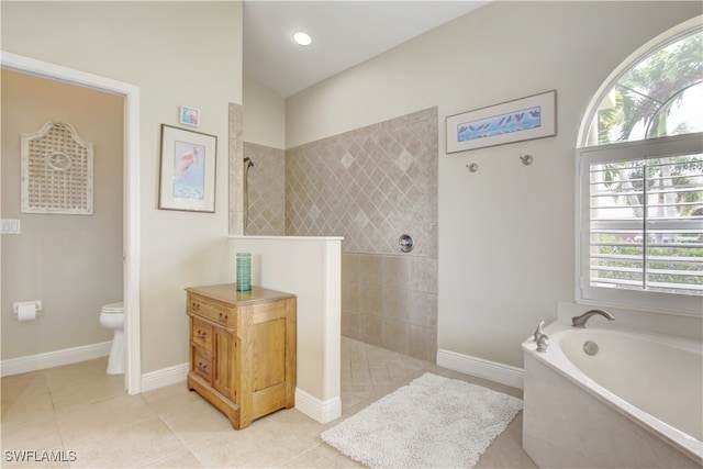 bathroom featuring tile patterned flooring, shower with separate bathtub, and toilet