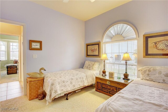 bedroom with ceiling fan and carpet floors