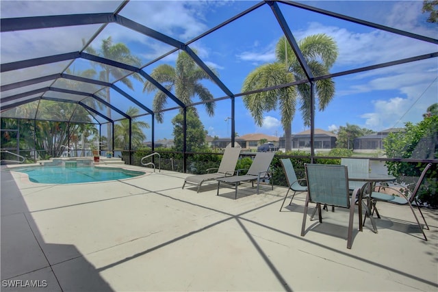 view of pool with a patio and a lanai