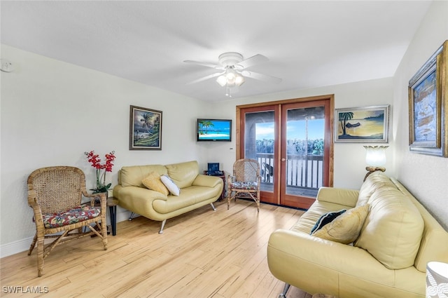 living room featuring a ceiling fan, french doors, baseboards, and light wood finished floors