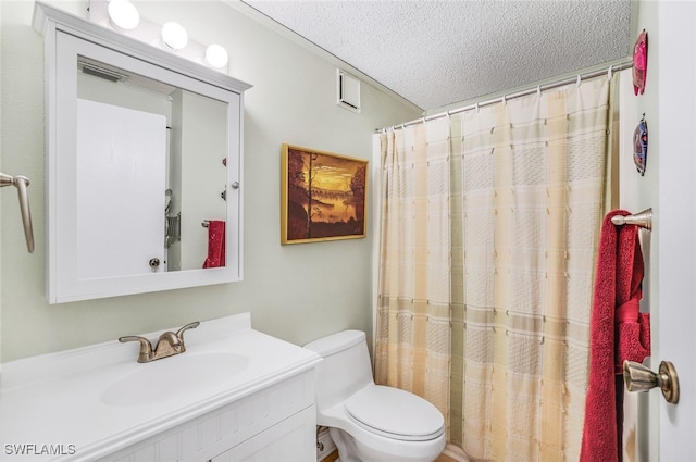 bathroom featuring a textured ceiling, toilet, vanity, and curtained shower