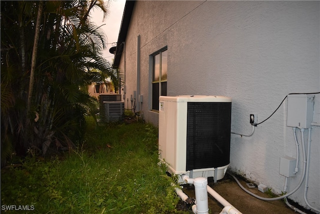 view of home's exterior with cooling unit