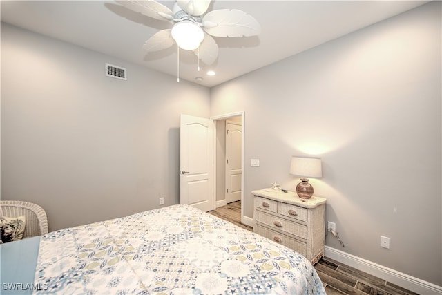 bedroom with ceiling fan and wood-type flooring