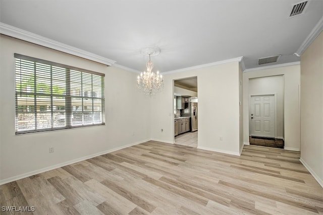 unfurnished dining area with light hardwood / wood-style floors, crown molding, and an inviting chandelier