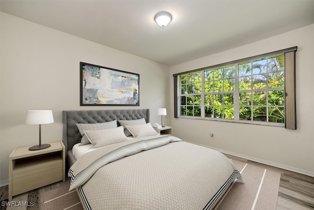 bedroom with light hardwood / wood-style flooring