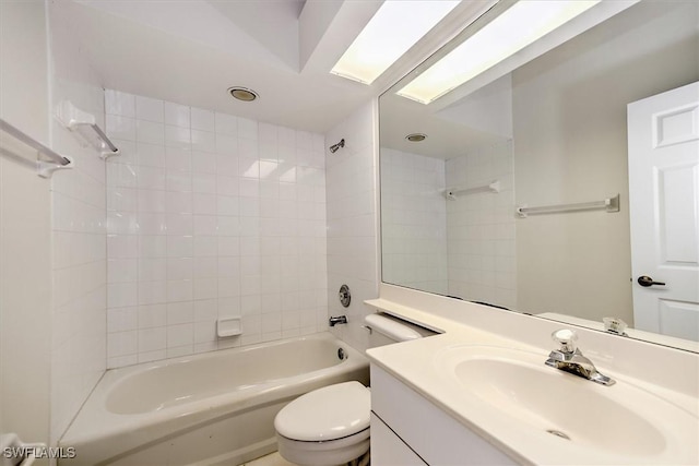 bathroom featuring  shower combination, vanity, and toilet