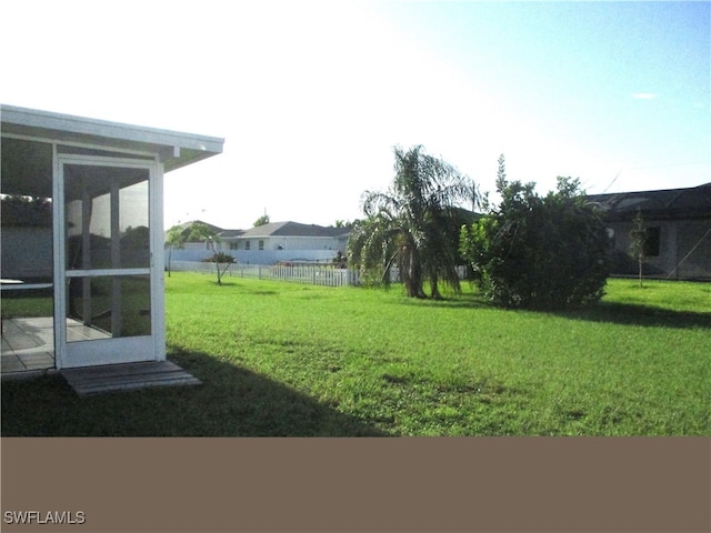 view of yard with a sunroom