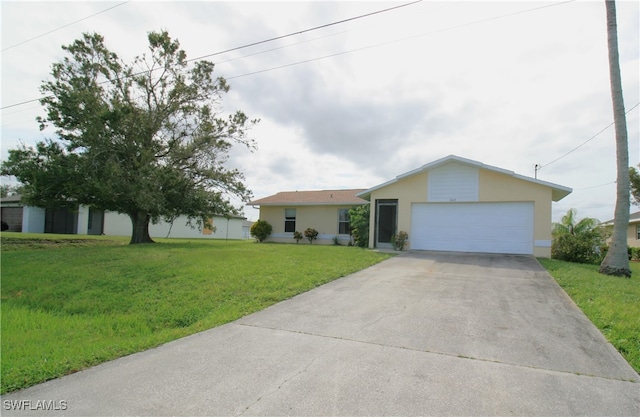 single story home featuring a garage and a front lawn