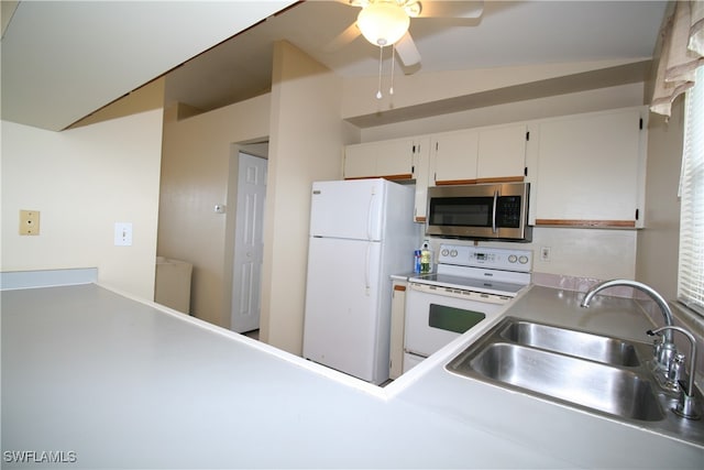 kitchen featuring ceiling fan, white cabinetry, vaulted ceiling, sink, and white appliances