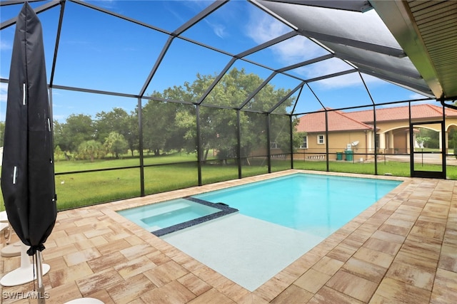 view of swimming pool featuring glass enclosure, a yard, a patio, and an in ground hot tub