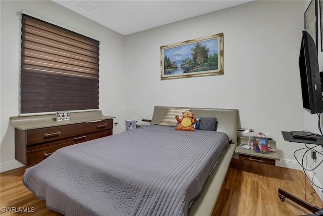 bedroom with light hardwood / wood-style flooring