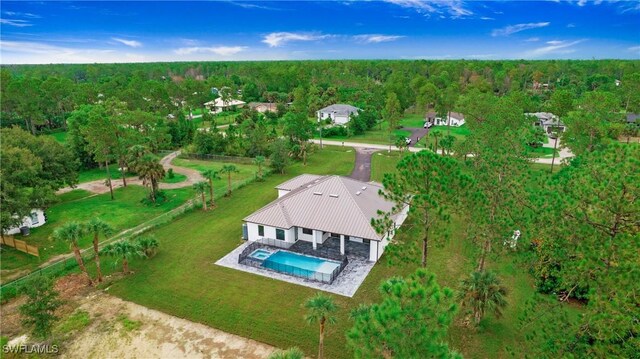 3660 4th Ave NE, Naples, FL 34120 - drone / aerial view with a view of trees
