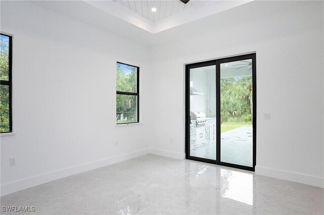 empty room with a tray ceiling