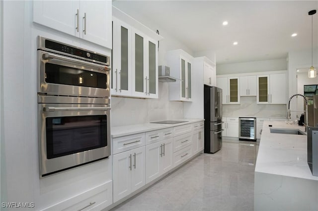 3660 4th Ave NE, Naples, FL 34120 - kitchen featuring white cabinets, a sink, stainless steel appliances, and beverage cooler