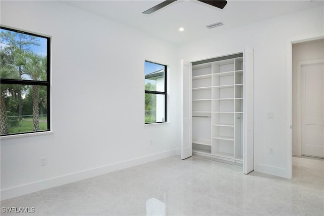 3660 4th Ave NE, Naples, FL 34120 - unfurnished bedroom featuring baseboards, a closet, visible vents, and recessed lighting