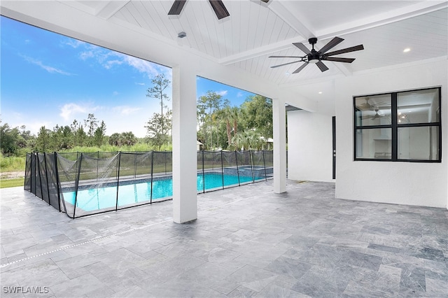 view of swimming pool with ceiling fan and a patio