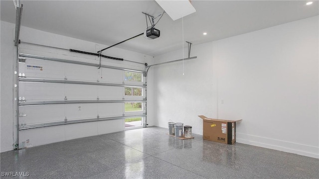 3660 4th Ave NE, Naples, FL 34120 - garage featuring a garage door opener and recessed lighting