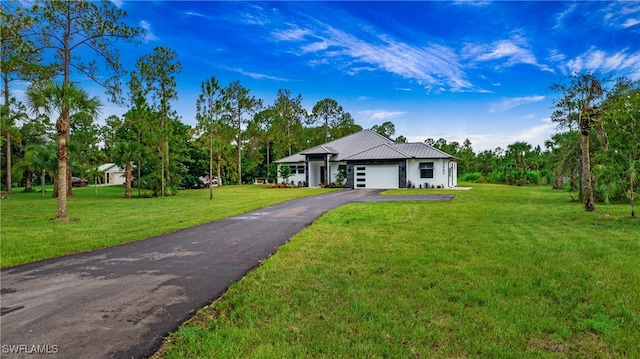 single story home featuring a front yard and a garage