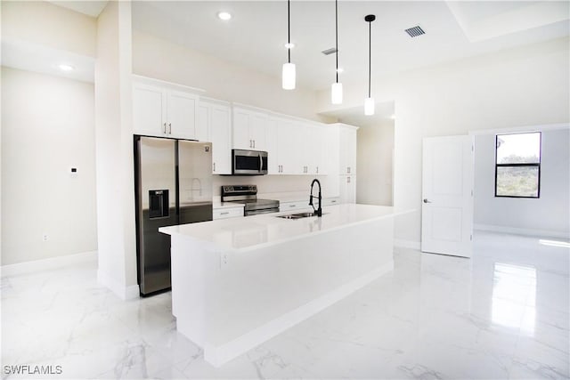 kitchen featuring marble finish floor, stainless steel appliances, visible vents, a kitchen island with sink, and a sink