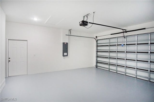 garage with electric panel and a garage door opener