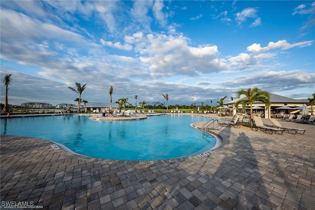 view of swimming pool featuring a patio area