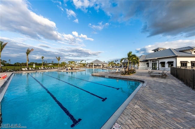 view of swimming pool with a patio