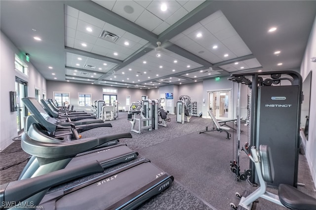 gym featuring carpet flooring and coffered ceiling