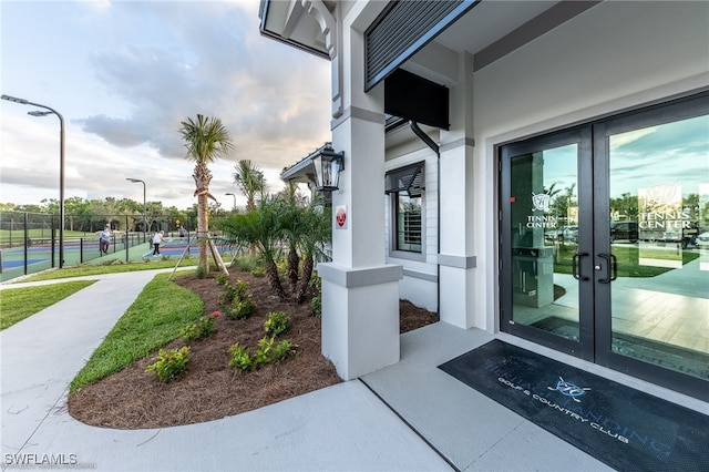 doorway to property featuring a yard