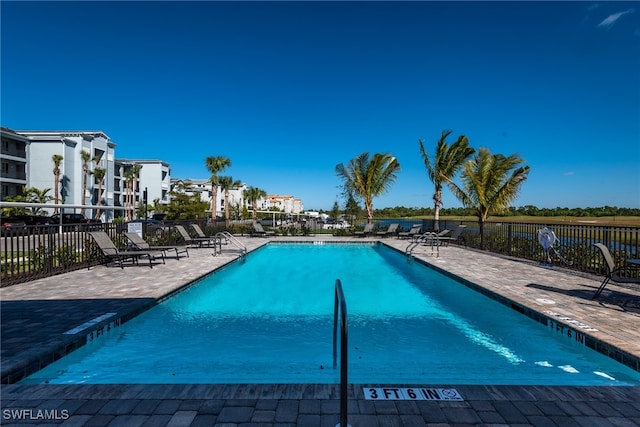 view of swimming pool with a patio area