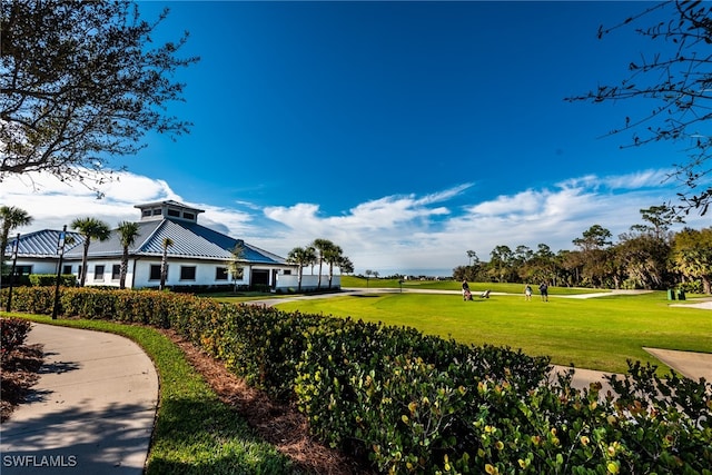 surrounding community featuring a lawn