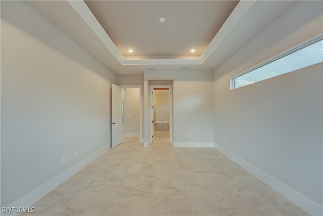 interior space with a raised ceiling