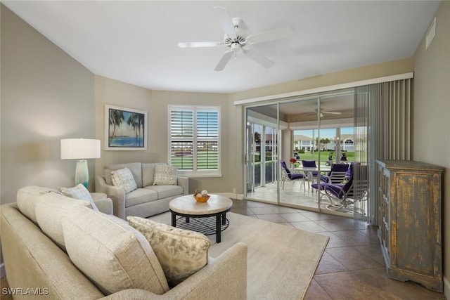 tiled living room featuring ceiling fan