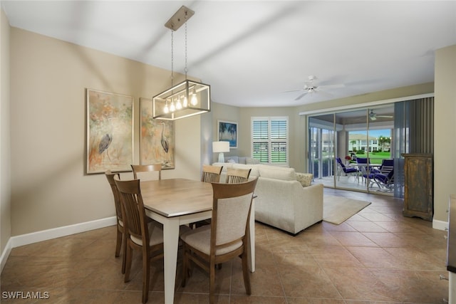 tiled dining space with baseboards, a ceiling fan, and a healthy amount of sunlight