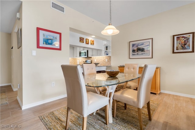 dining room with light wood-type flooring