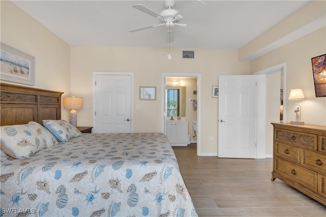 bedroom featuring ensuite bathroom, ceiling fan, and light hardwood / wood-style floors