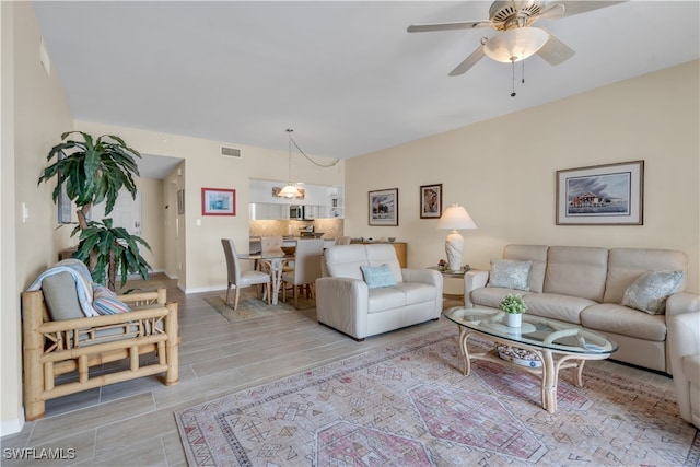 living room featuring ceiling fan