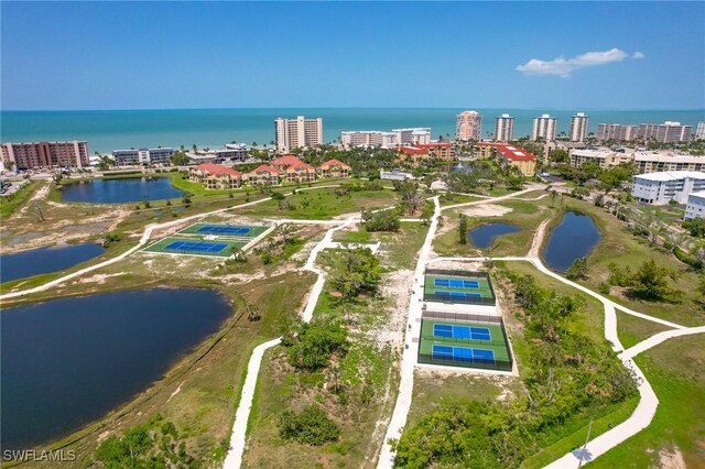 birds eye view of property with a water view