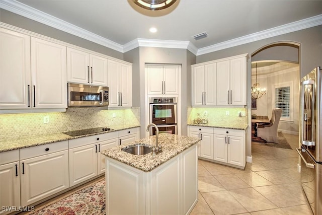 kitchen with white cabinets, appliances with stainless steel finishes, and sink