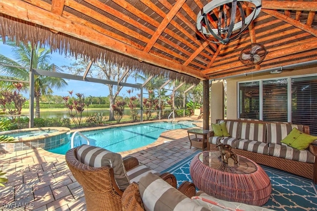 view of swimming pool with a lanai, a patio area, an in ground hot tub, and a water view