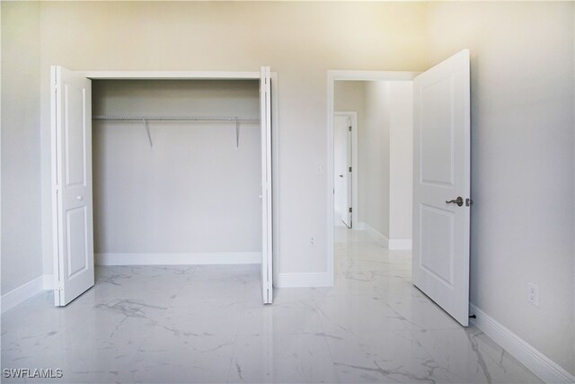 unfurnished bedroom with a closet