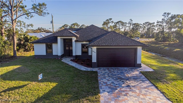 single story home with a front lawn and a garage