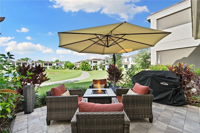 view of patio / terrace featuring an outdoor living space with a fire pit and a grill