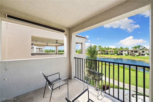 balcony featuring a water view