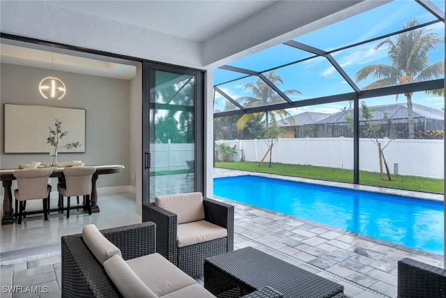 view of pool with a fenced in pool, outdoor lounge area, a patio area, fence, and a lanai