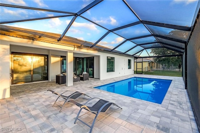 pool with a patio area and an outdoor hangout area