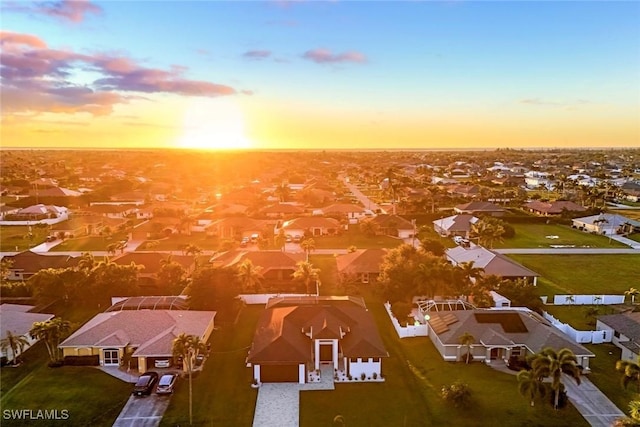 aerial view at dusk with a residential view